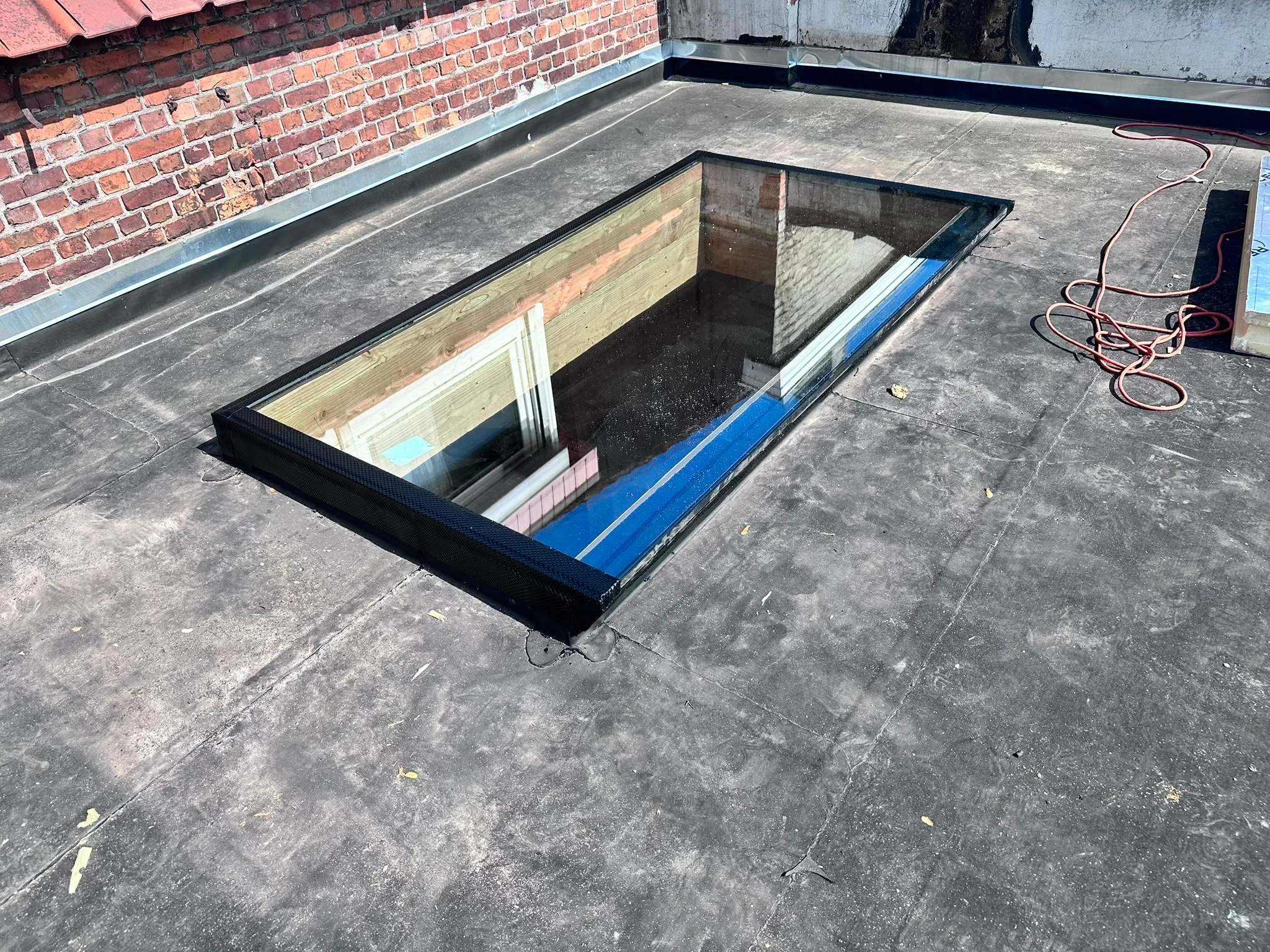 Lichtschacht installatie op plat dak